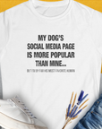 My Dogs Social Media Page Is More Popular Than Mine, Women's T-Shirt-White. For dog lovers and dog owners. Design by Dog Gang