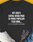 My Dogs Social Media Page Is More Popular Than Mine, Women's T-Shirt-Black. A perfect gift for dog lovers and dog owners. Design by Dog Gang