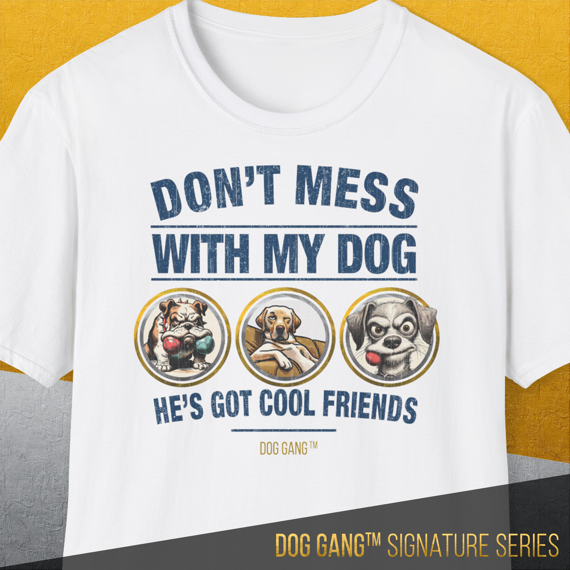 The white Dog Gang™ Signature Series, Volume 1 T-shirt features “DON’T MESS WITH MY DOG HE’S GOT COOL FRIENDS” above three dogs in yellow circles, with DOG GANG SIGNATURE SERIES at the bottom. Made from soft-style Baumwolle for comfort.