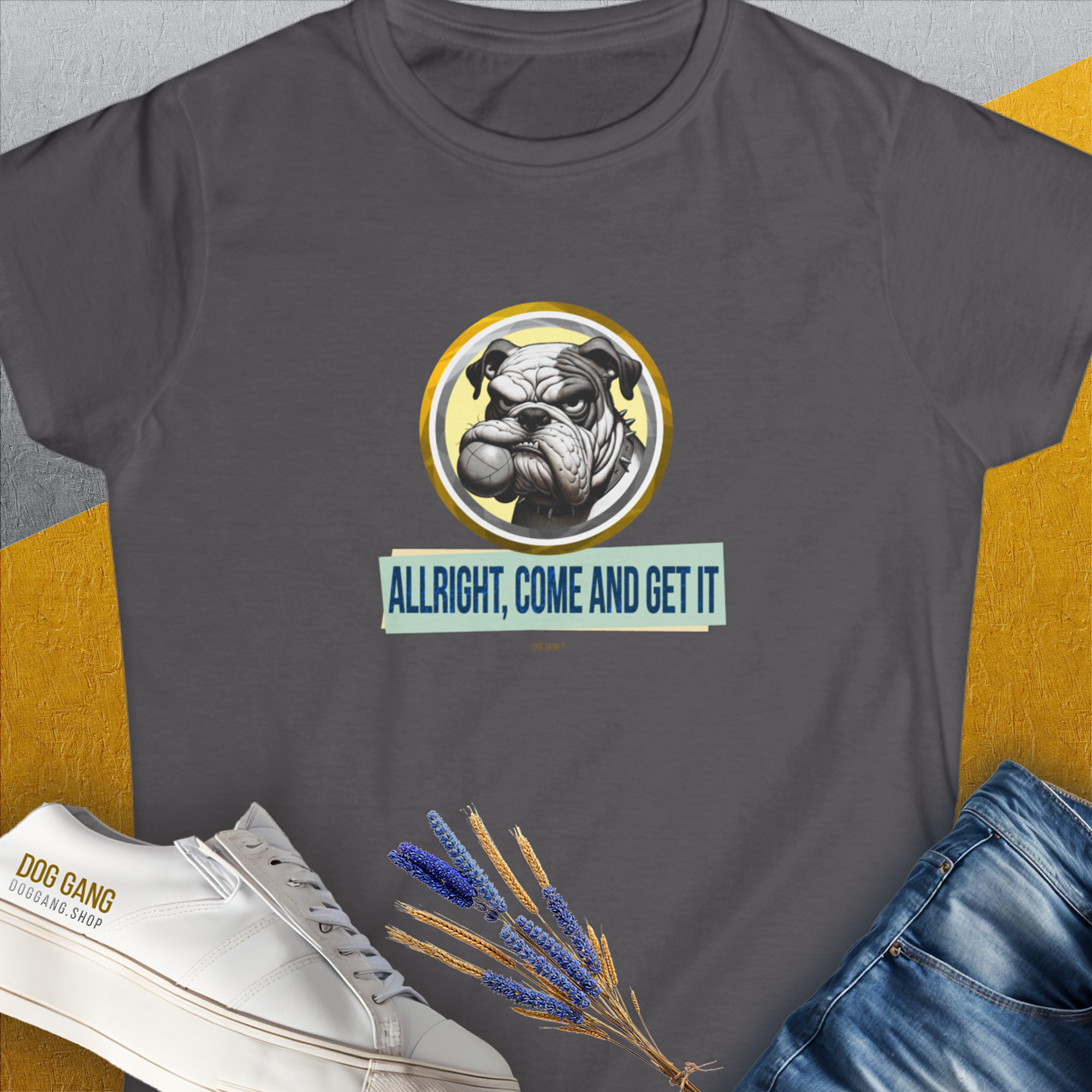 From the legendary "Allright Come And Get It"-series, Volume 1 Womens T-Shirt in charcoal showcases a vintage bulldog graphic holding a fetch ball in his mouth and reads ALLRIGHT, COME AND GET IT. Perfect for any dog lover. Designed by Dog Gang.