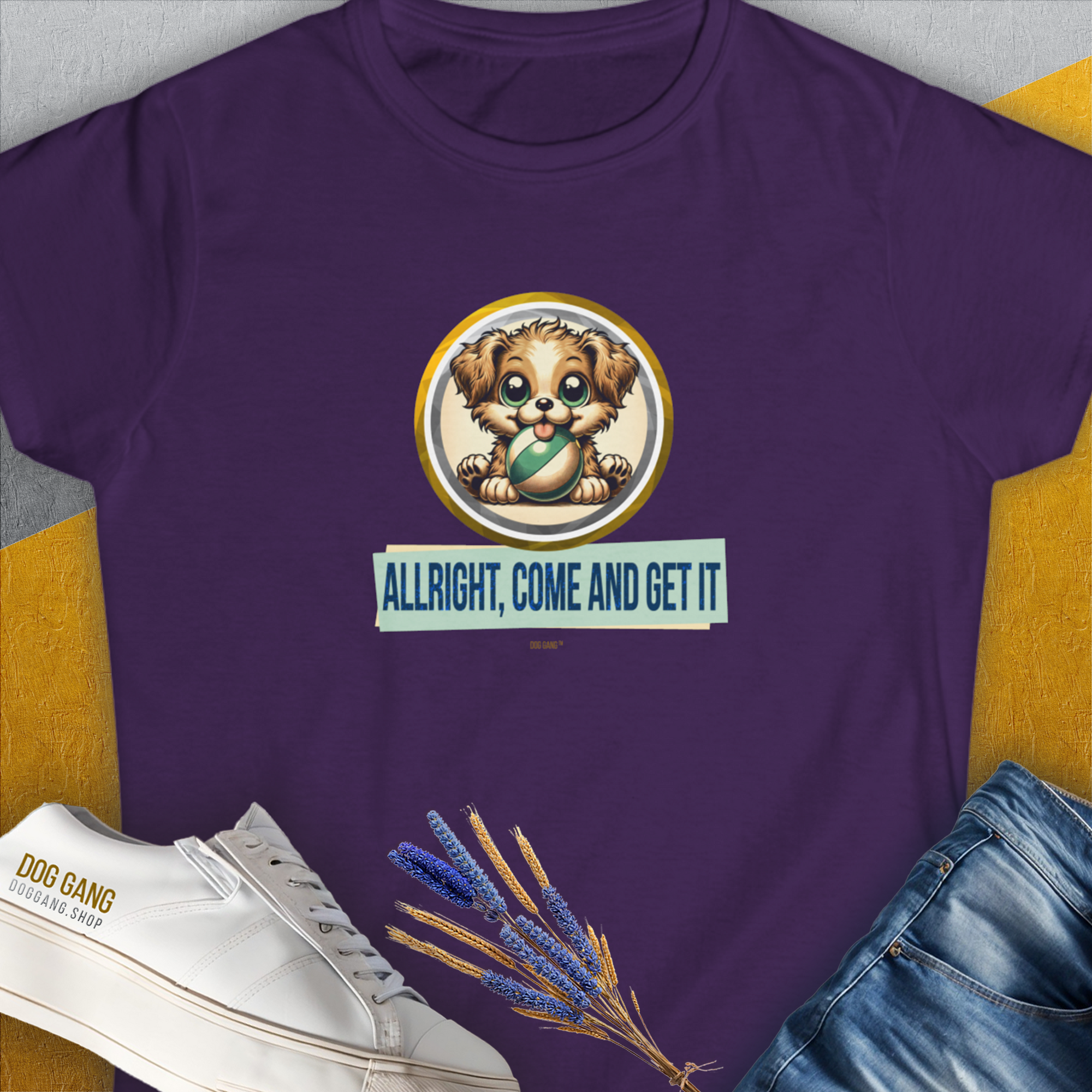 Purple Allright Come And Get It, Volume 4, womens T-shirt with a cartoon puppy holding a ball crafted from soft ringspun cotton. Text: "ALLRIGHT, COME AND GET IT", perfect for any dog lover. Designed by Dog Gang.