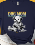 Designed by Dog Gang, this dog lover gift unisex t-shirt in navy features a DOG MOM design with a cute puppy, toy bone, and toy mouse. Ideal for any casual outing.