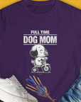 The shirt showcases the quote "Full Time Dog Mom" alongside a cartoon dog on a scooter. Its a perfect funny dog shirt for any dog owner or lover. Designed by Dog Gang.