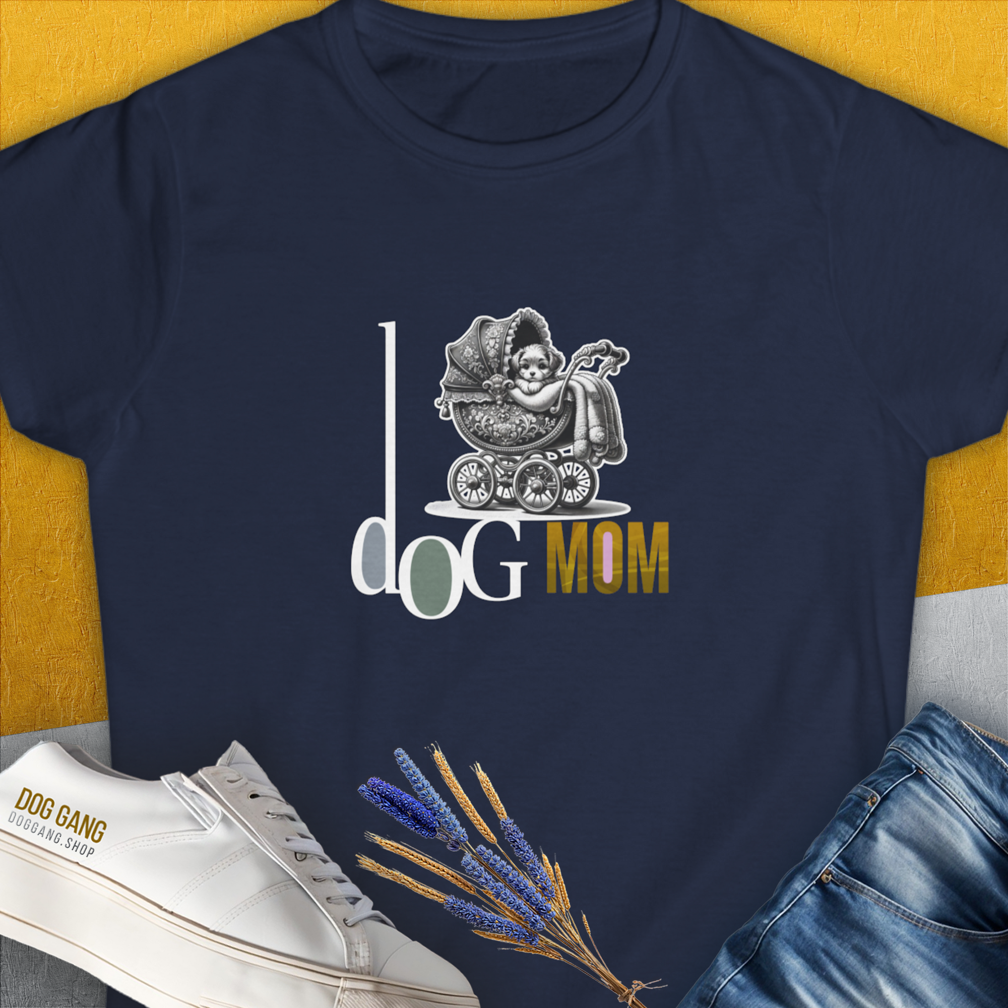 Dog-themed shirt featuring a playful graphic of a dog in a stroller with the phrase Dog Mom Series, Volume 5. Designed by Dog Gang.