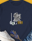 Dog-themed shirt featuring a playful graphic of a dog in a stroller with the phrase Dog Mom Series, Volume 5. Designed by Dog Gang.