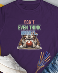 The women's t-shirt in purple features a cute dog design with a bulldog guarding a ball and the saying "Don't Even Think About It..., Volume 5". Perfect for the funny dog shirt collection. Design by Dog Gang.