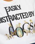 Close-up of a white unisex T-shirt, Easily Distracted By Dogs Series, Volume 1, featuring bold black letters and dog illustrations perfect for any dog lover. Designed by Dog Gang.