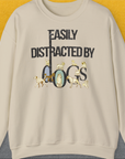 Unisex sweatshirt in sand features Easily Distracted by Dogs with charming dog illustrations. Cozy and stylish for any dog lover. Designed by Dog Gang.