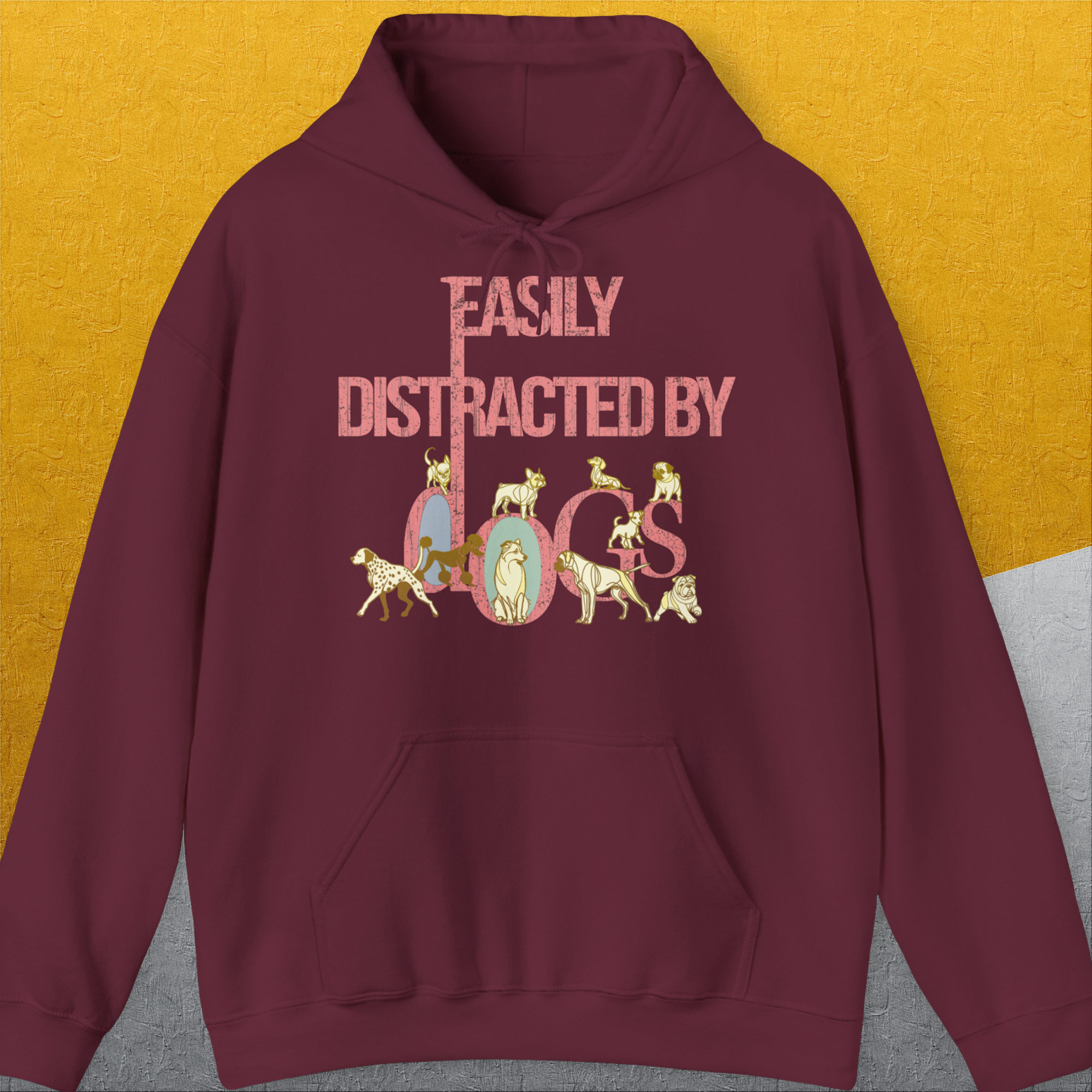 Maroon unisex hoodie: Easily Distracted By Dogs Series, Volume 2 with playful dog illustrations. Perfect for any dog person. Designed by Dog Gang.