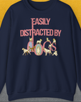 Cute dog design: The unisex navy sweatshirt showcases playful dog illustrations alongside the quote Easily Distracted By Dogs. Designed by Dog Gang.