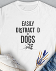 White Easily Distracted by Dogs Womens T-Shirt, Volume 3 series, features a funny dog graphic. Ideal for any dog lover, crafted from ringspun cotton for cozy wear. Designed by Dog Gang.