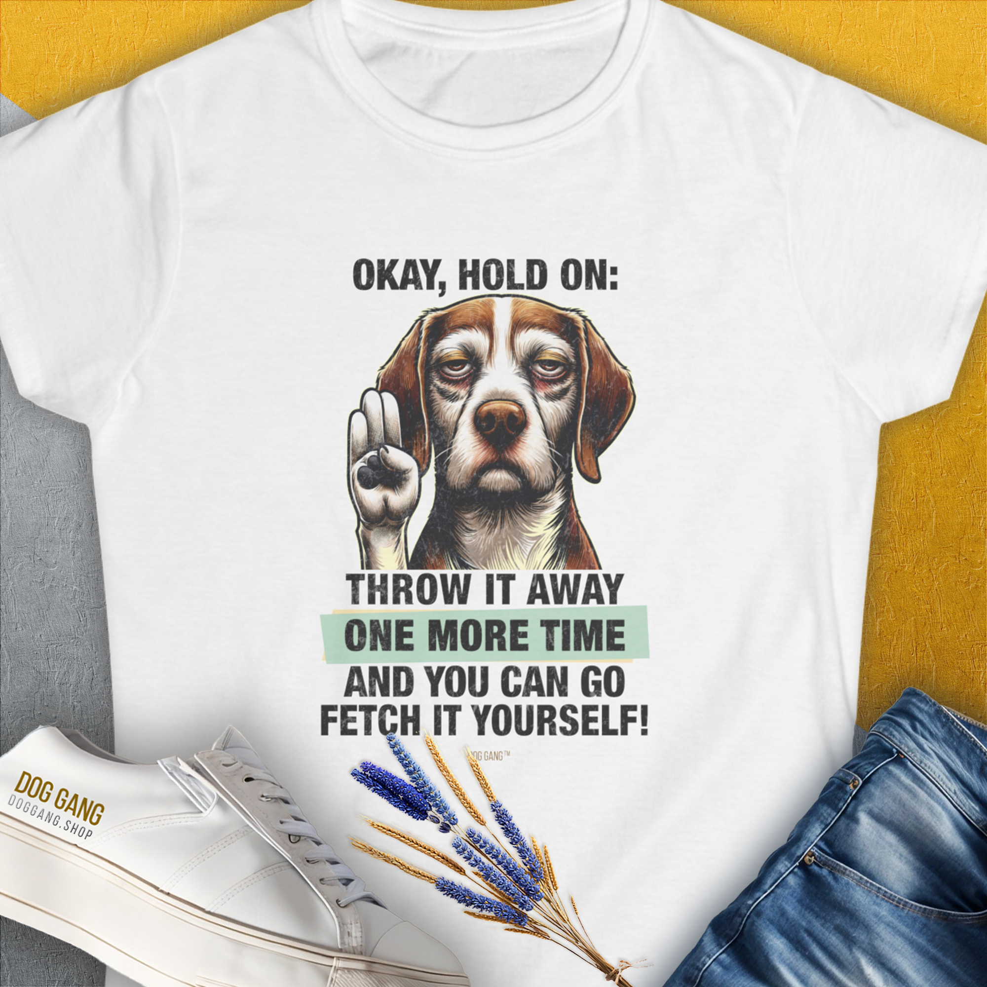 The Go Fetch It Yourself Series, Volume 3 women’s white t-shirt features a playful dog graphic with a funny dog quote. Designed by Dog Gang.