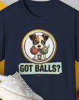 The T-shirt showcases a cartoon dog with 2 fetch balls and the playful quote, GOT BALLS? Perfect for any dog lover. Designed by Dog Gang.