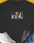Black shirt with a cute dog design and the saying I Love Dogs - Series I, Volume 5. Perfect for any dog lover or as a dog lover gift. Designed by Dog Gang.