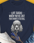 The navy Life Sucks When Youve Lost Your Favorite Fetch Ball, Volume 7 womens T-shirt features a funny dissapointed poodle illustration. Designed by Dog Gang.