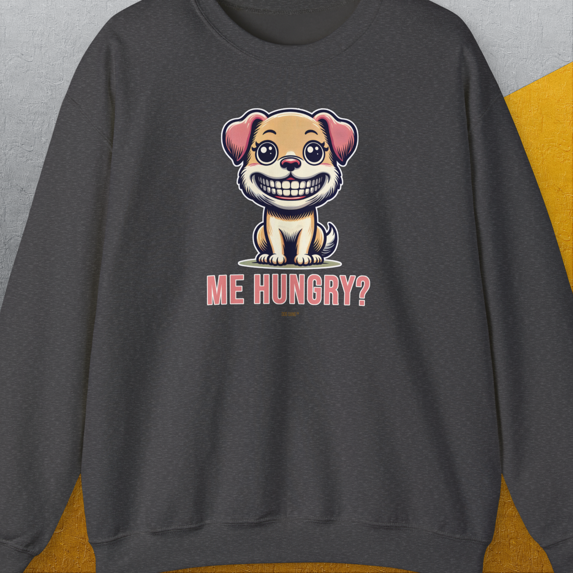 The Dark Heather sweatshirt showcases a cartoon dog with ME HUNGRY? text, perfect for any dog lover. Designed by Dog Gang.