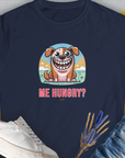 This navy tee showcases a cartoon dog with the text Me Hungry? Volume 3 in a cute dog design. Perfect for any dog lover. Designed by Dog Gang.