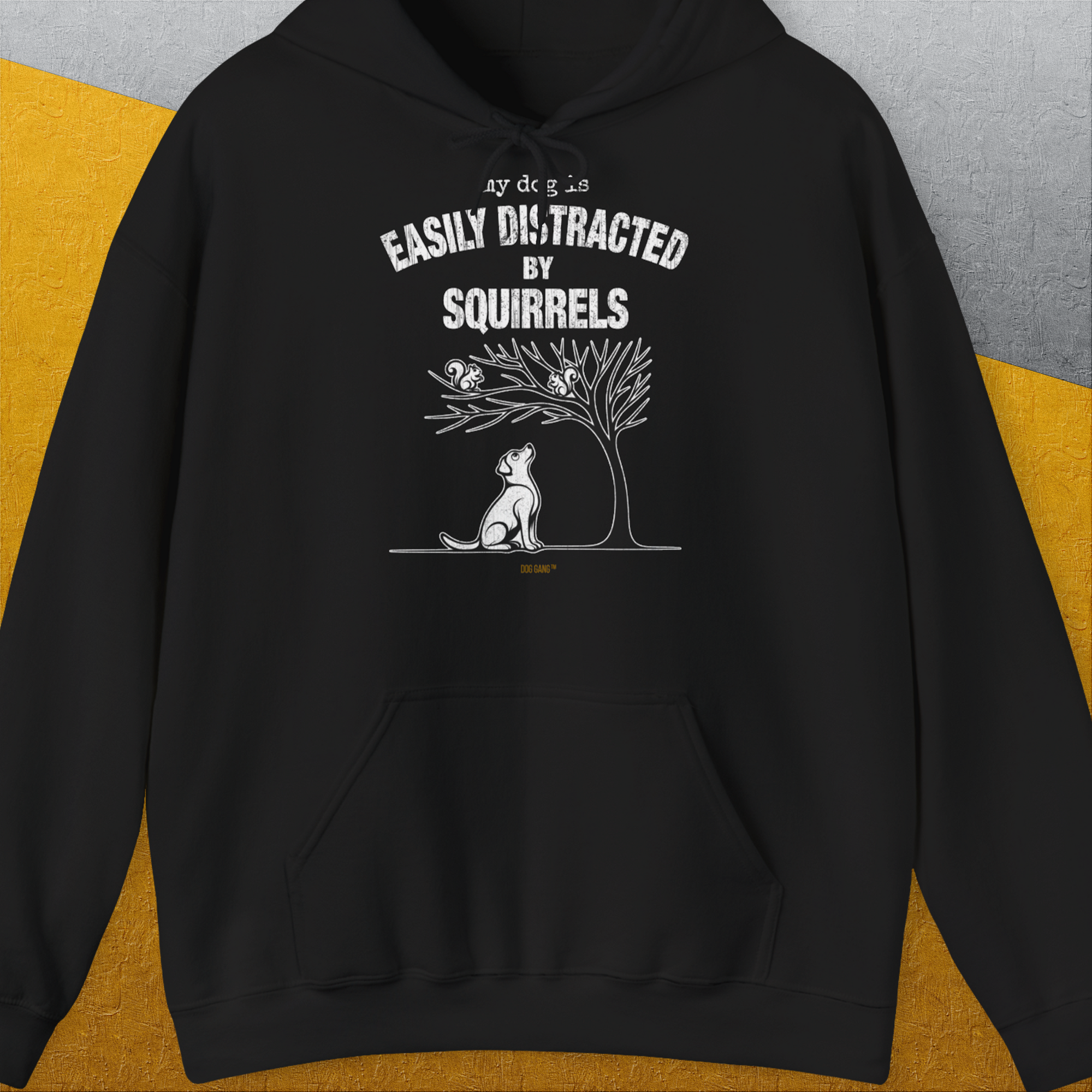 The Easily Distracted by Squirrels hoodie sports a funny dog print in white, highlighting dog owners humor. Designed by Dog Gang.
