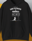 The Easily Distracted by Squirrels hoodie sports a funny dog print in white, highlighting dog owners humor. Designed by Dog Gang.