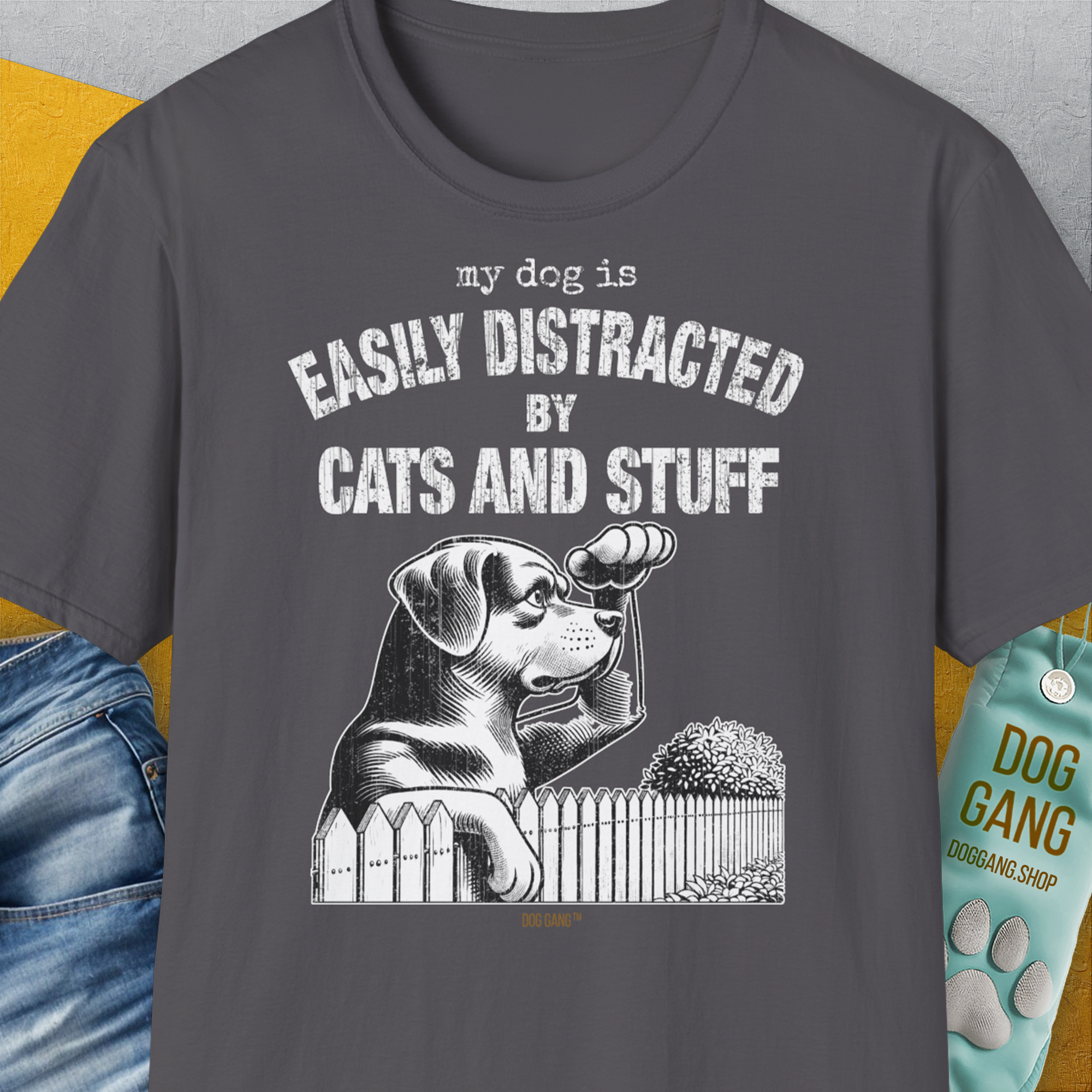 Unisex charcoal t-shirt with My Dog Is Easily Distracted By - Volume 2: Cats And Stuff, showcasing a playful dog illustration and text. Perfect for any dog lover gift. Designed by Dog Gang.
