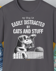 Unisex charcoal t-shirt with My Dog Is Easily Distracted By - Volume 2: Cats And Stuff, showcasing a playful dog illustration and text. Perfect for any dog lover gift. Designed by Dog Gang.