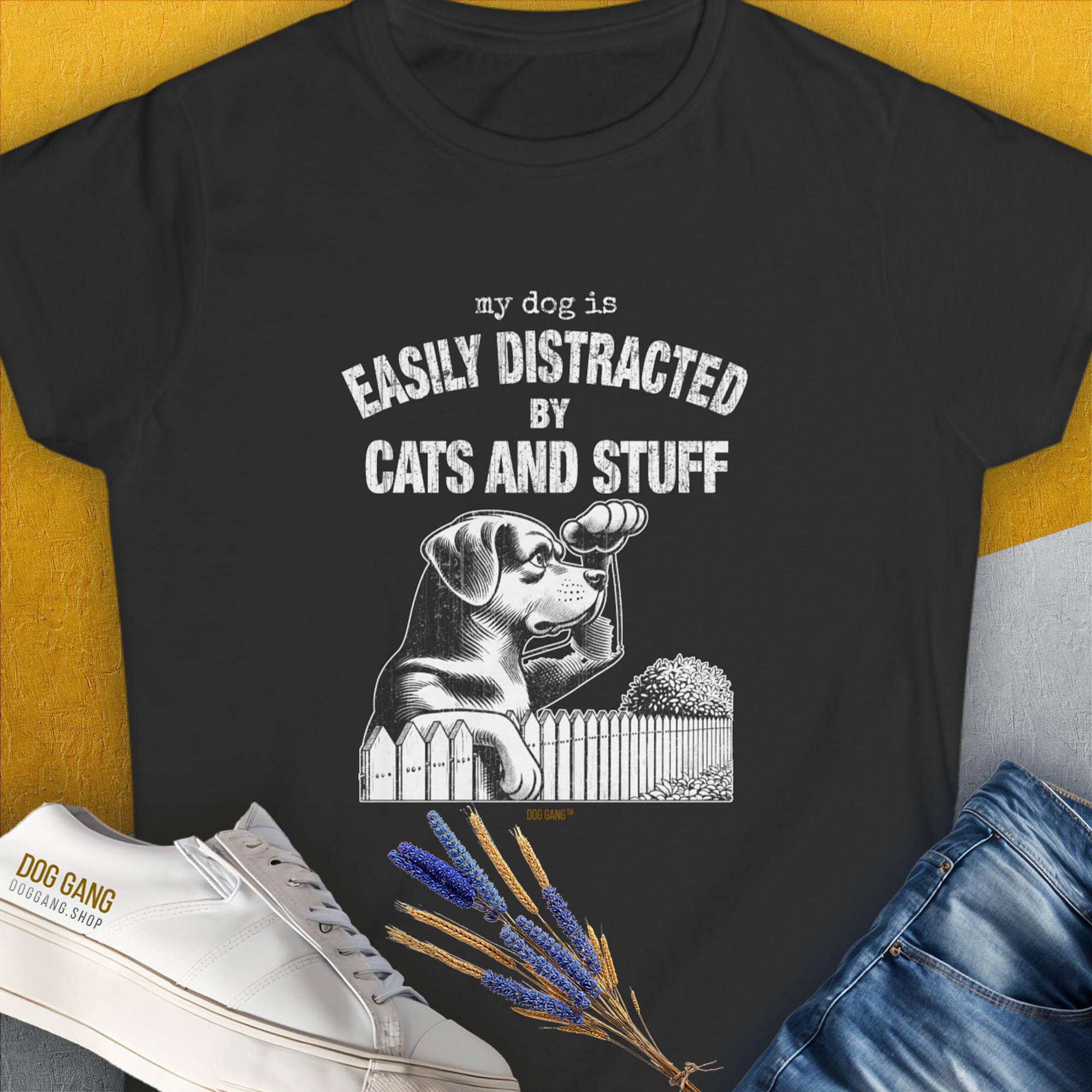 Womens black t-shirt made from ringspun cotton features a funny dog illustration with the saying My dog is easily distracted by cats and stuff. Designed by Dog Gang.