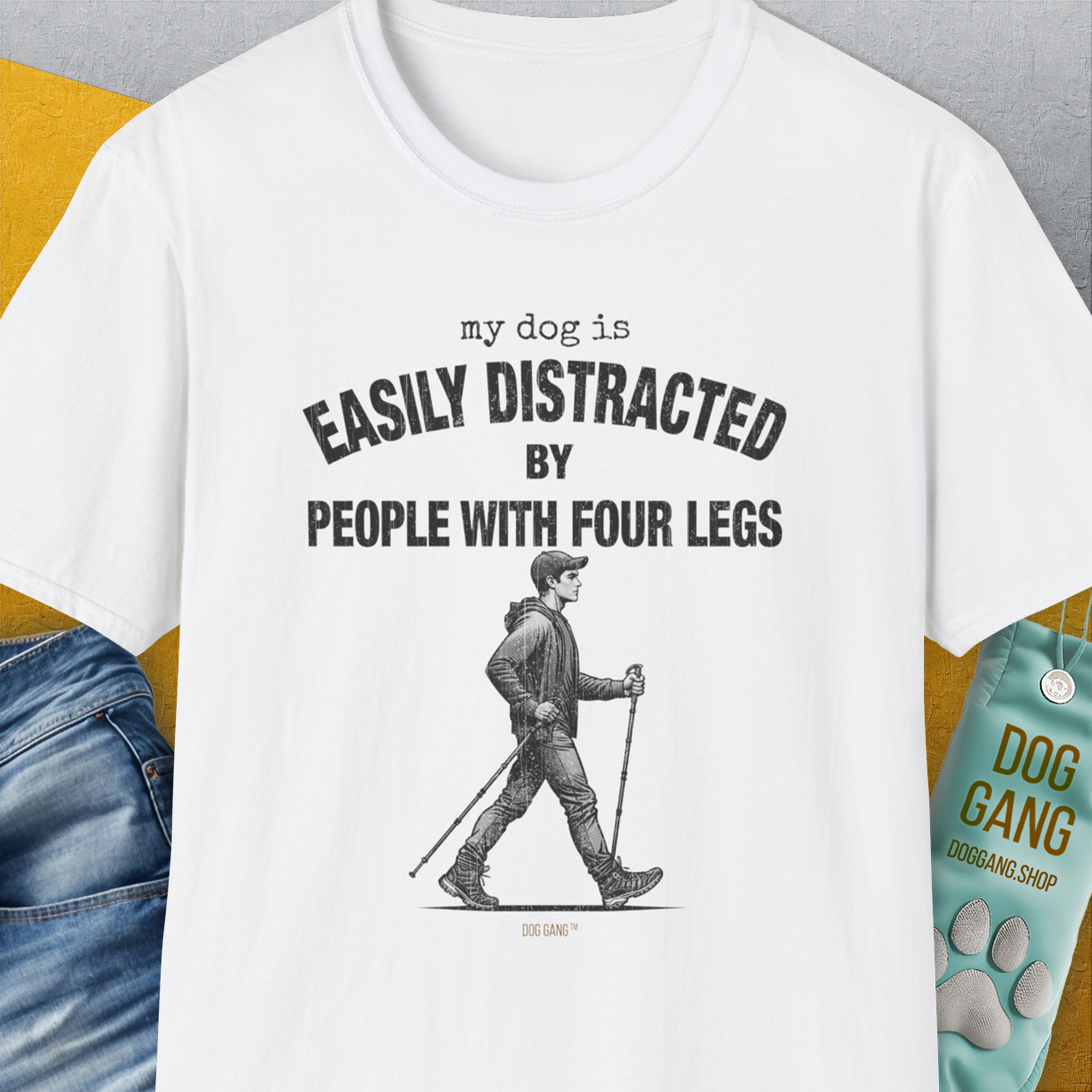 The My Dog Is Easily Distracted By - Volume 5: People With Four Legs unisex T-shirt is a funny dog shirt on soft, white 100% cotton with a playful message and man-walking illustration. Designed by Dog Gang.