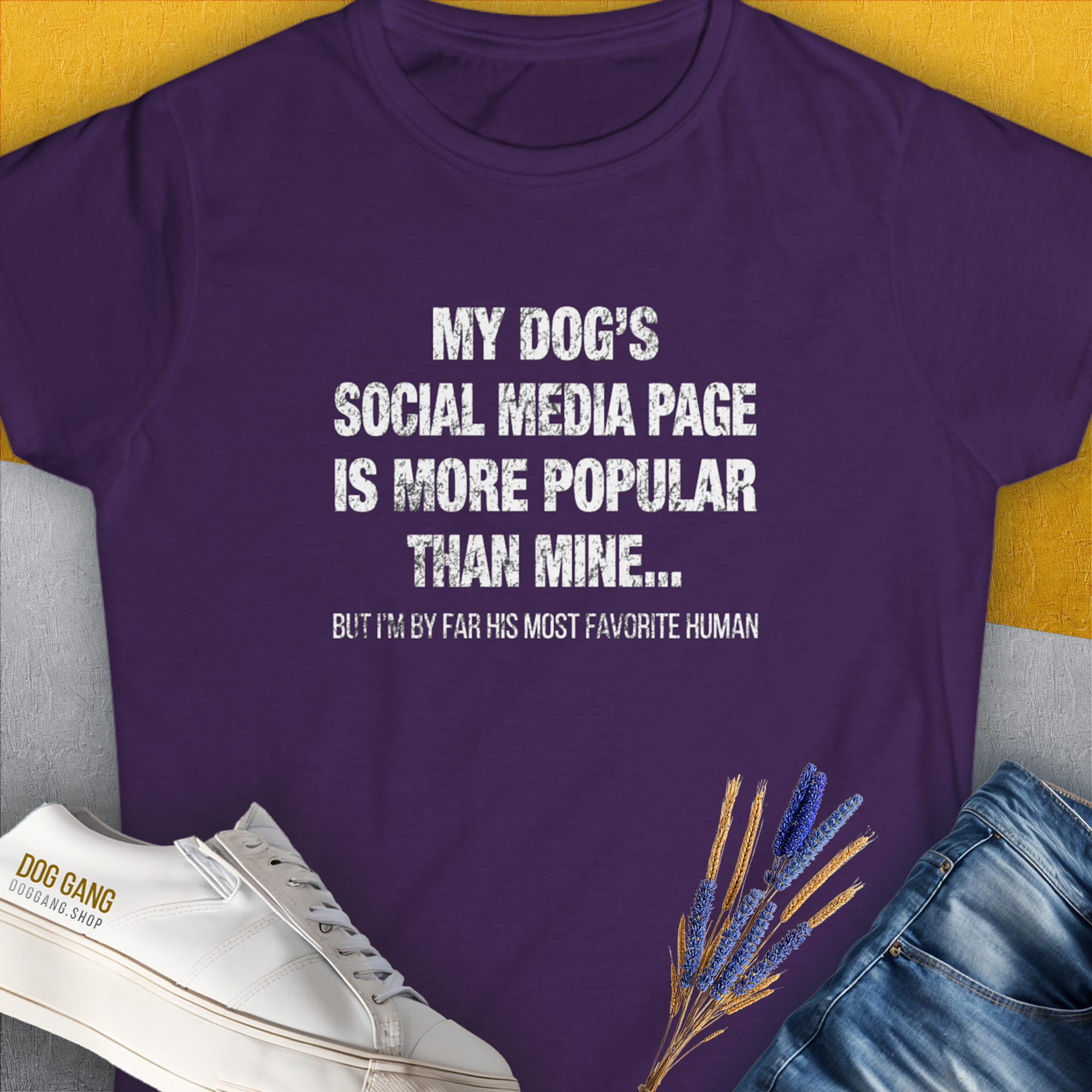 The "My Dogs Social Media Page Is More Popular Than Mine" womens T-shirt in purple features a funny dog quote, crafted from ringspun cotton. Designed by Dog Gang.