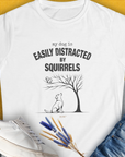 My Dog Is Easily Distracted By - Volume 1: Squirrels, Women's T-Shirt-White. For dog lovers and dog owners. Design by Dog Gang