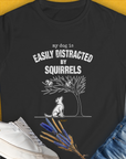 My Dog Is Easily Distracted By - Volume 1: Squirrels, Women's T-Shirt-Black. A perfect gift for dog lovers and dog owners. Design by Dog Gang