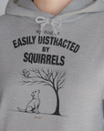 My Dog Is Easily Distracted By - Volume 1: Squirrels, Unisex Hoodie-, Design by Dog Gang