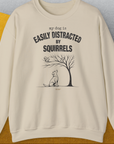 My Dog Is Easily Distracted By - Volume 1: Squirrels, Unisex Sweatshirt-Sand. A dog-themed Design from Dog Gang