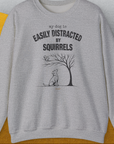 My Dog Is Easily Distracted By - Volume 1: Squirrels, Unisex Sweatshirt-Sport Grey. A perfect gift for dog lovers and dog owners. Design by Dog Gang