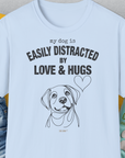 My Dog Is Easily Distracted By - Volume 3: Love And Hugs, Unisex T-Shirt-Light Blue, Design by Dog Gang