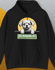 Der schwarze Unisex-Kapuzenpullover der Serie „Say Hi“, Band 1, zeigt einen Cartoon-Welpen mit dem englischsprachigen Text „Ich möchte allen Hundeliebhabern da draußen einfach ‚Hallo‘ sagen!“ Entworfen von Dog Gang.