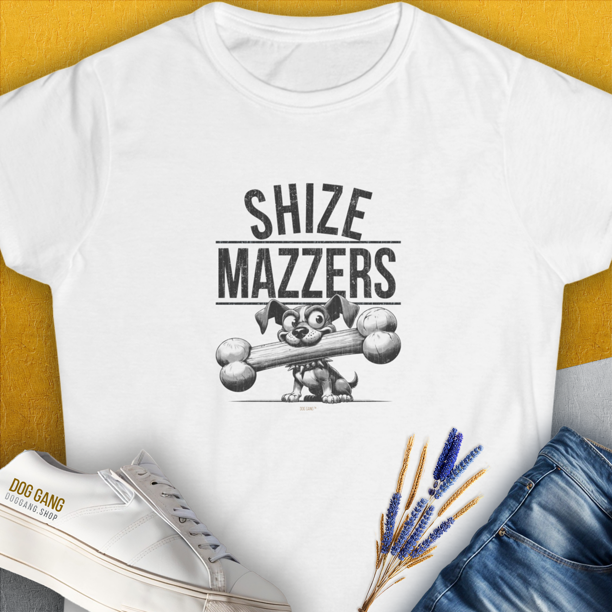 Featuring a funny cartoon dog holding an oversized bone in its mouth, preventing it from speaking properly. The text reads "SHIZE MAZZERS". Perfect for any dog lover. Designed by Dog Gang.
