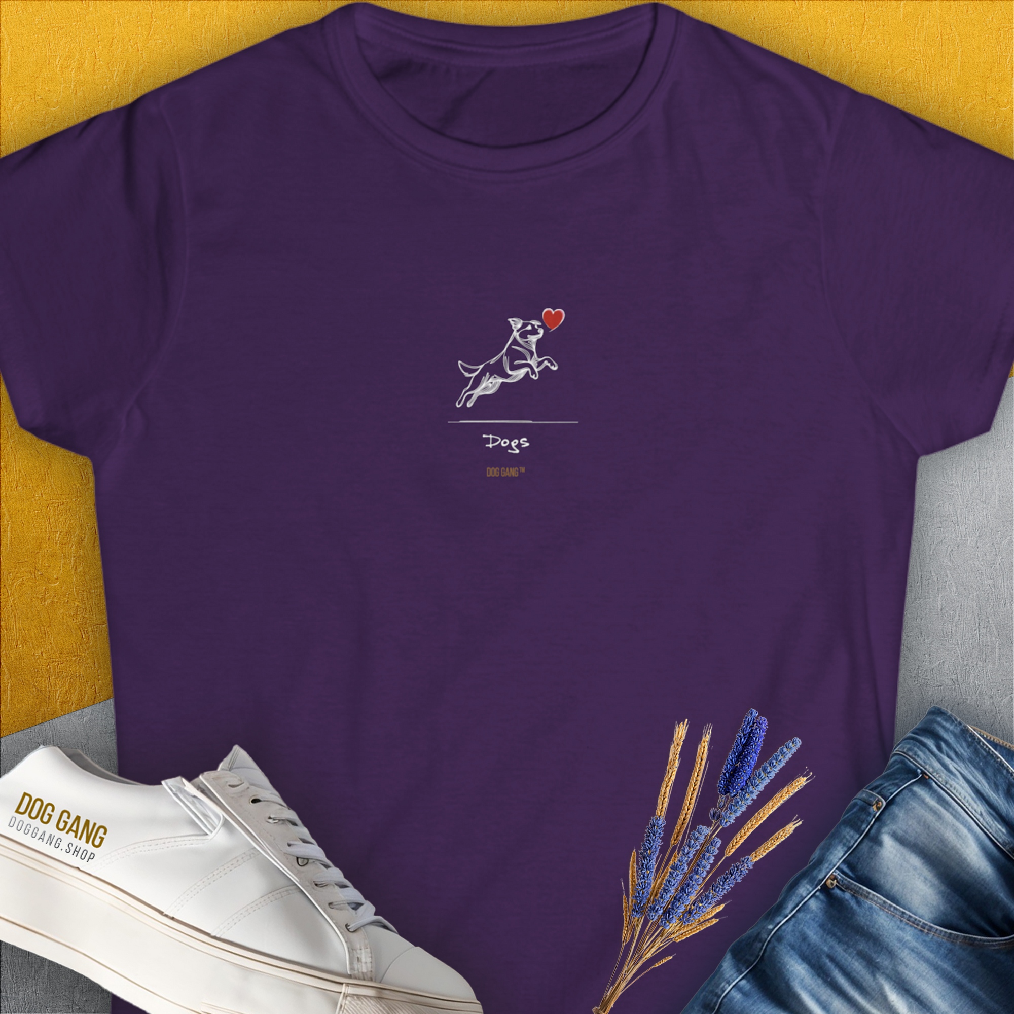 Purple tee from The Dog Gang Minimalistic Series I, Volume 3 features a dog chasing a heart. Perfect for any dog owner who loves a touch of playful charm. Designed by Dog Gang.