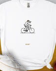 Playful cartoon dog riding a bike. Perfect for any dog lover person. Designed by Dog Gang.