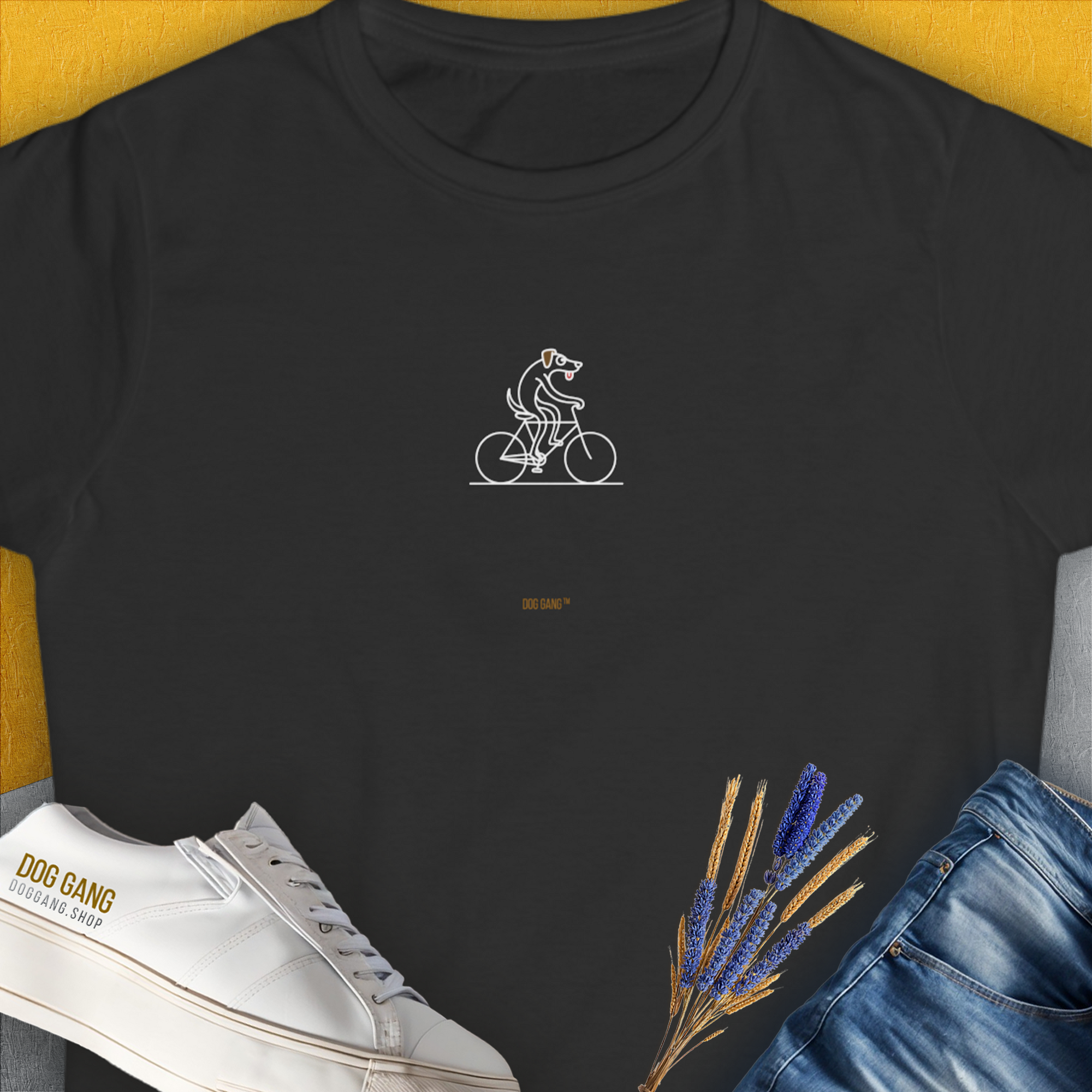 The Dog Gang Minimalistic Series I, Volume 4, Womens T-Shirt in black showcases a dog on a bicycle in a minimal line drawing. Perfect for any dog lover. Designed by Dog Gang.