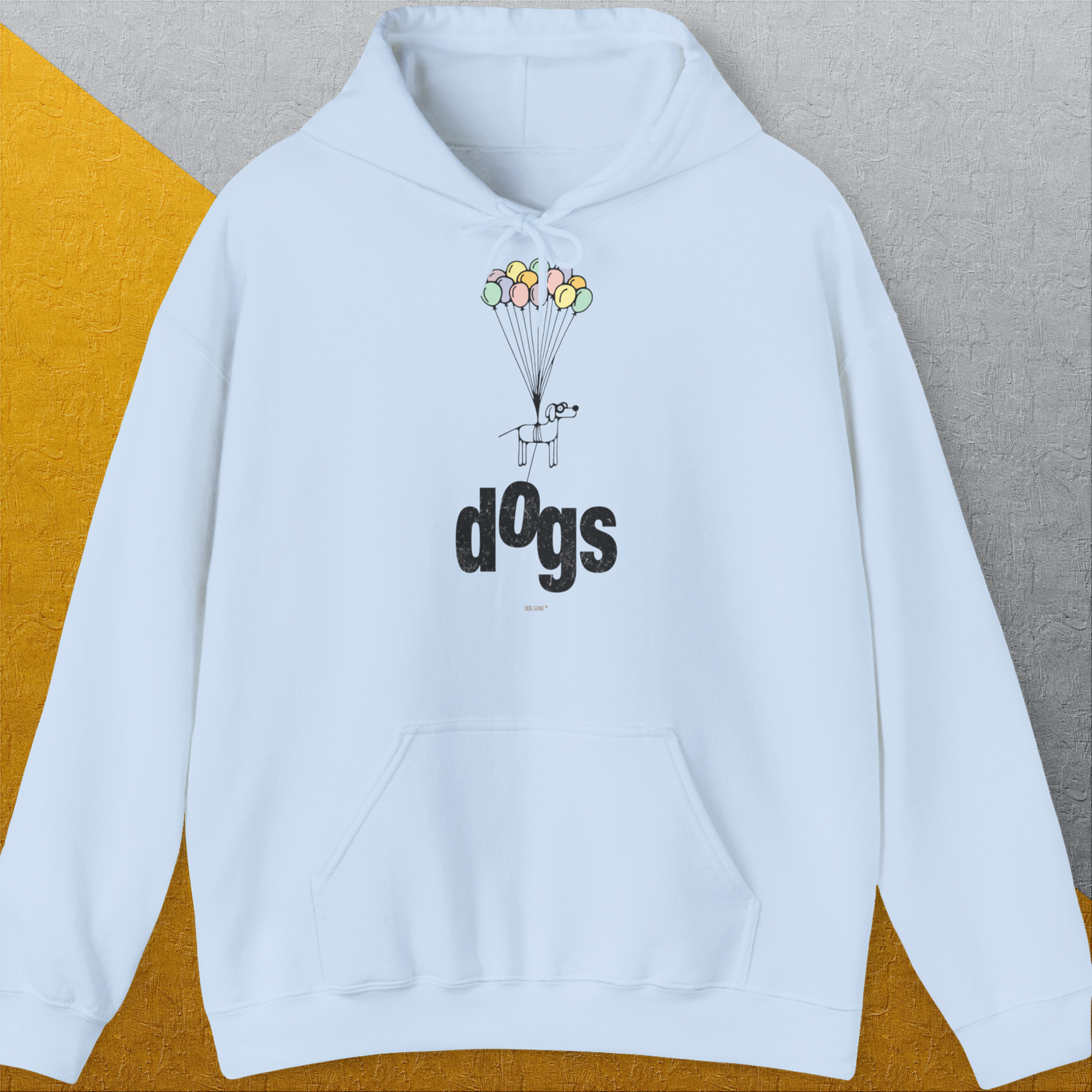 Der hellblaue Unisex-Kapuzenpullover Dog Gang Minimalistic Series II, Volume 1 zeigt das Wort „Dogs“ und einen Cartoon-Hund mit Luftballons, der vom Boden abhebt. Entworfen von Dog Gang.