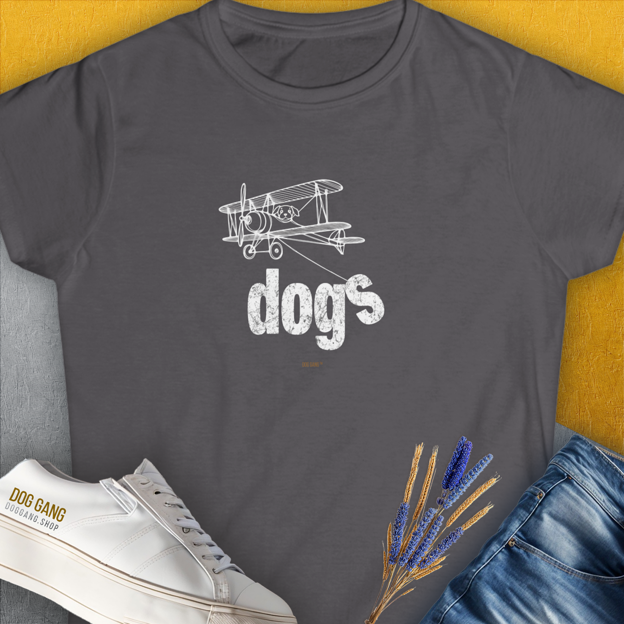 Vintage airplane and dogs text create a dog lovers delight on this minimalistic tee. A dog-themed gem perfect for any dog person. Designed by Dog Gang.