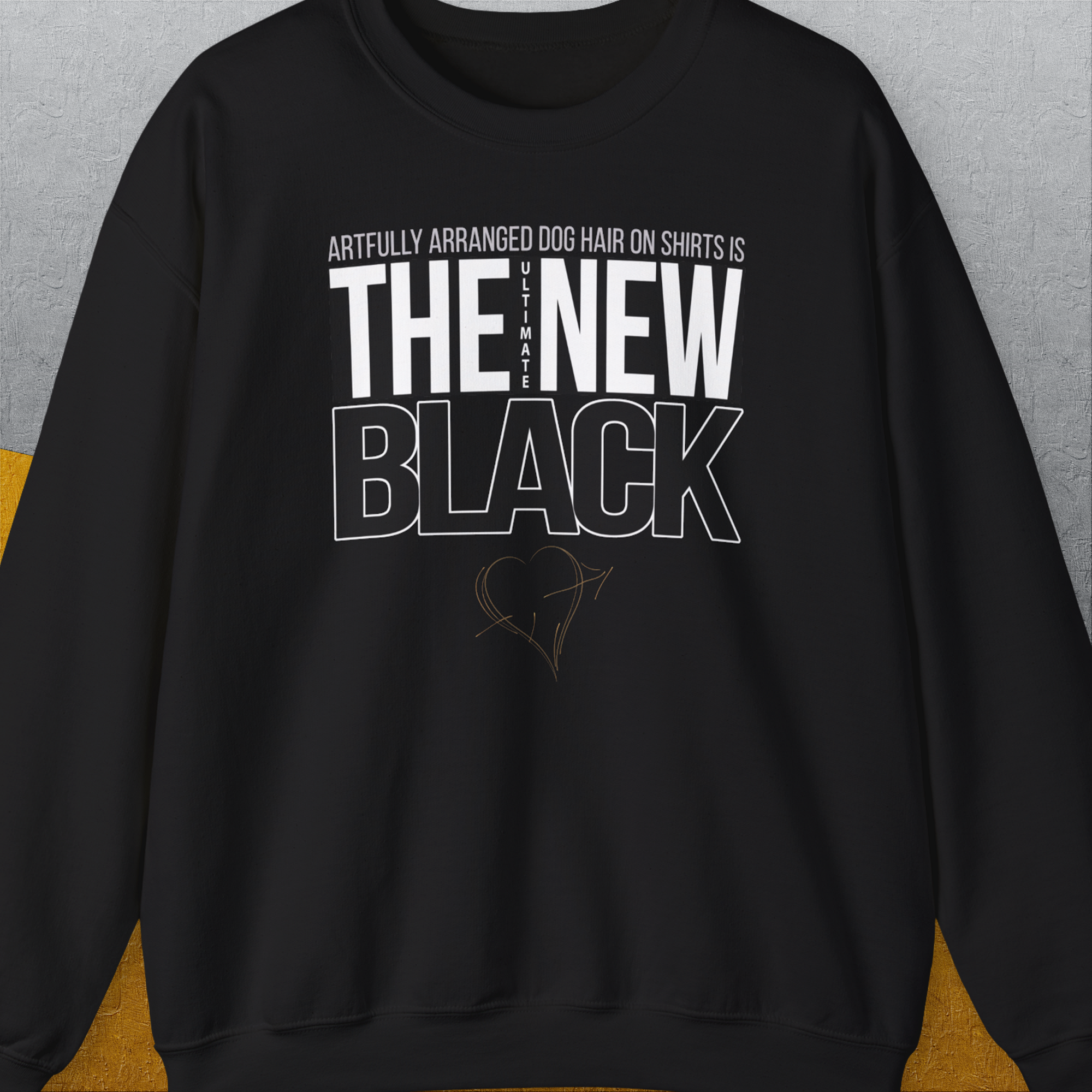 Volume 1 black unisex sweatshirt features: Artfully arranged dog hair on shirts is the ultimate new black, adorned with a charming heart sketch. Designed by Dog Gang.