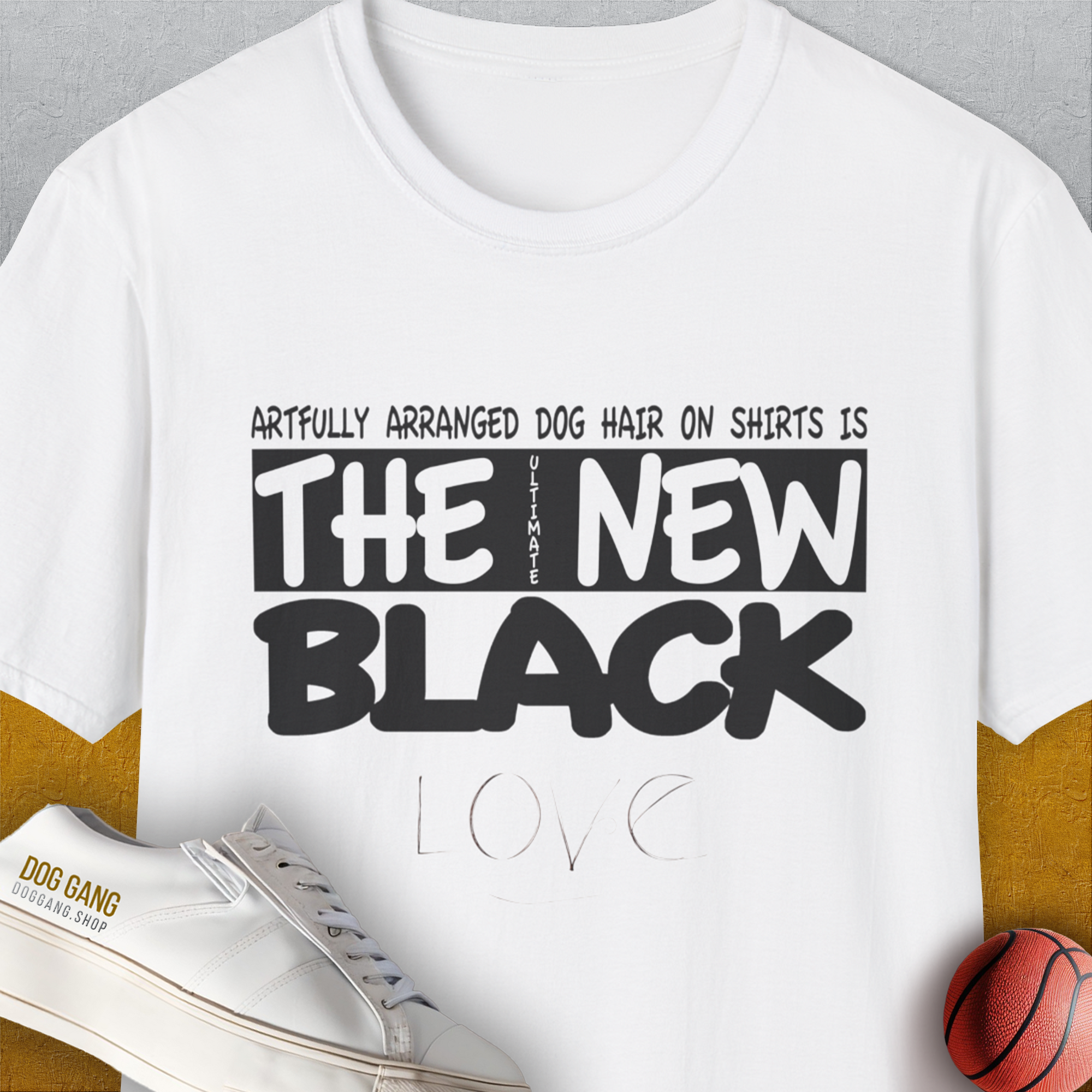 Dog lover gift: The shirt humorously claims, Dog hair on shirts is the new black, featuring a shoe and basketball. Designed by Dog Gang.