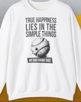 White unisex sweatshirt features the phrase True happiness lies in the simple things. My dog knows that with a cute dog chew toy design. Perfect for any dog lover gift. Designed by Dog Gang.