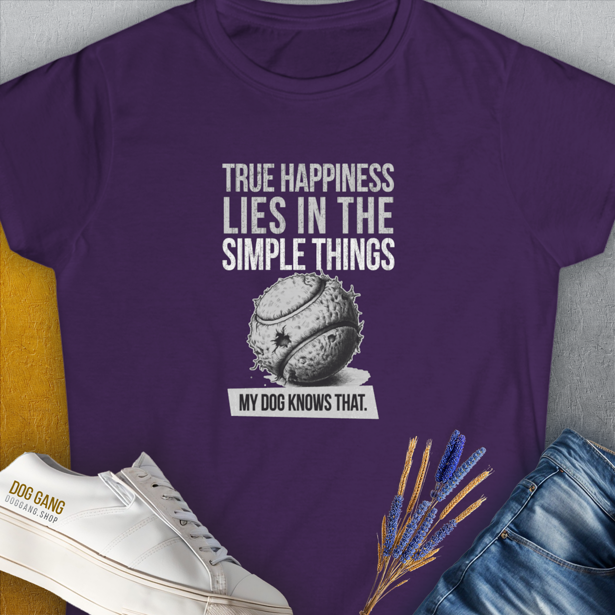 True Happiness Series One, Volume 1 womens T-shirt in purple showcases a baseball design with the quote True happiness lies in the simple things. My dog knows that. Perfect for any dog lover. Designed by Dog Gang.