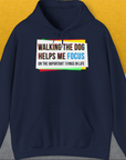 Designed by Dog Gang. This funny dog-themed hoodie displays the saying: Walking the dog helps me focus on the important things in life. Perfect for any dedicated dog lover.