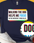 Navy Walking The Dog Series One, Volume 1 tee features the quote, Walking the dog helps me focus on the important things in life. Ideal for any dog lover. Designed by Dog Gang.