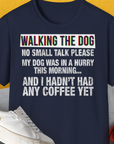 This funny dog shirt showcases the playful quote: WALKING THE DOG... NO SMALL TALK PLEASE... AND I HADNT HAD ANY COFFEE YET on a yellow background. Designed by Dog Gang.