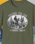Walking The Dog, Western Style, Volume 1 t-shirt features a cowboy and dog design with a vintage touch. Perfect for any dog person who loves the wild west. Designed by Dog Gang.