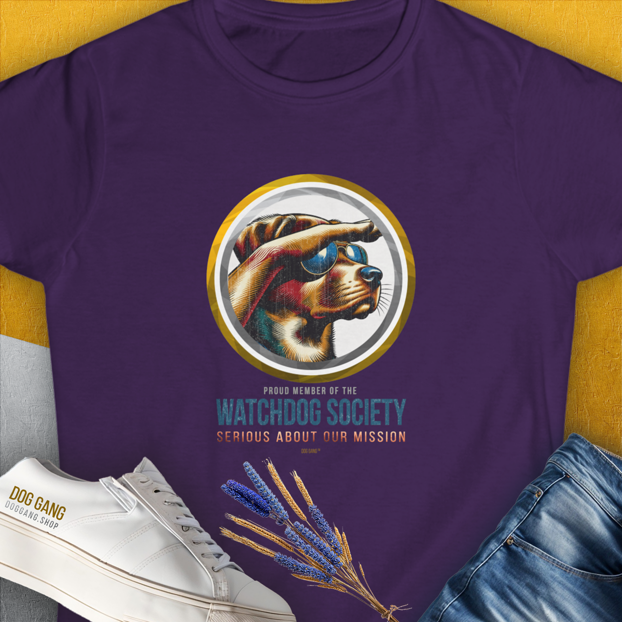 Womens T-Shirt in purple featuring a funny dog design with sunglasses and the quote: Watchdog Society, Serious About Our Mission. Ideal for any dog lover. Designed by Dog Gang.